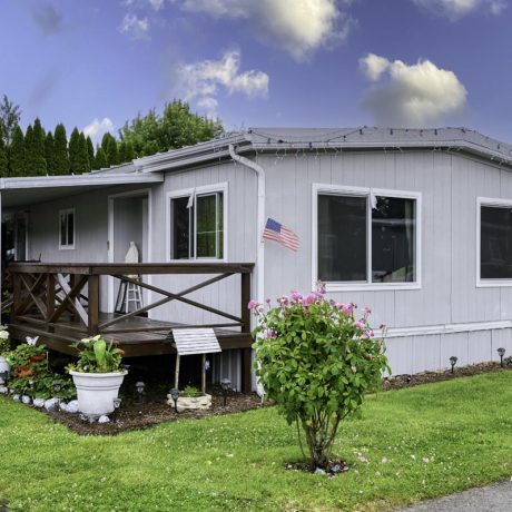 home exterior with grass and bushes